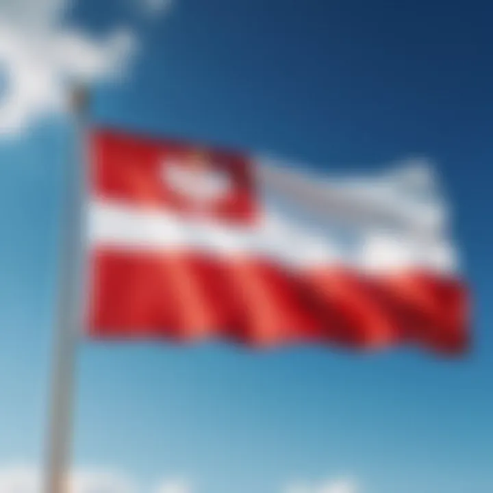 Polish national flag waving against a clear blue sky